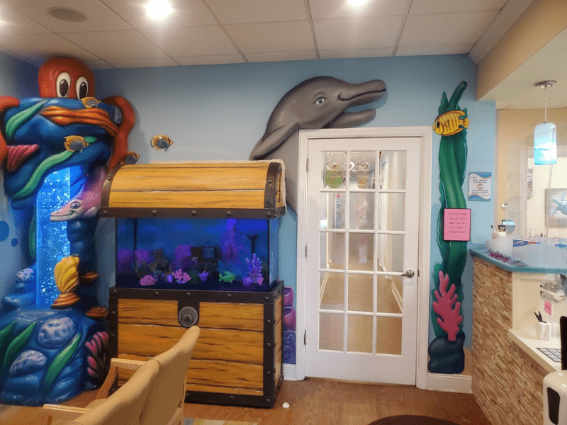Colorful fish tank in ocean-themed pediatric dental office in Moorestown