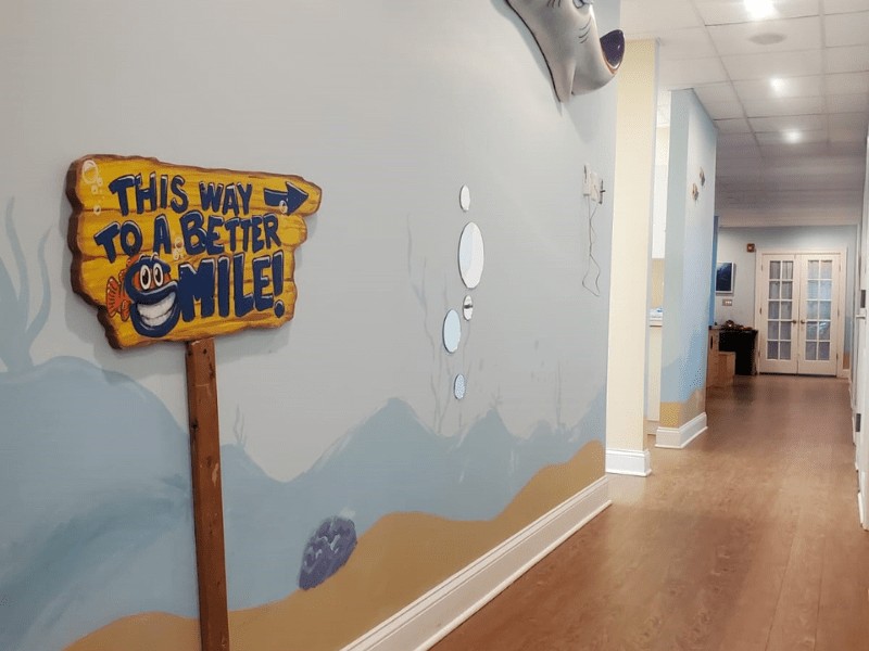 Marine-themed wall mural and play area at Moorestown pediatric dental office